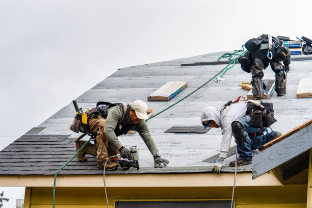 Professional Roofing technician working in Stratham, NH